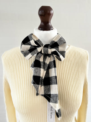 black bow tartan scarf on mannequin