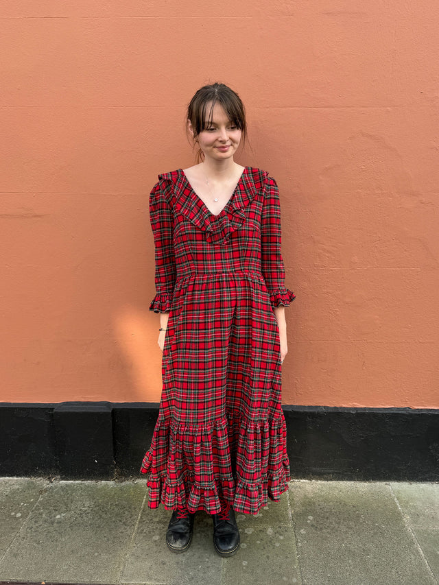 The Well Worn women wearing red tartan dress with ruffles