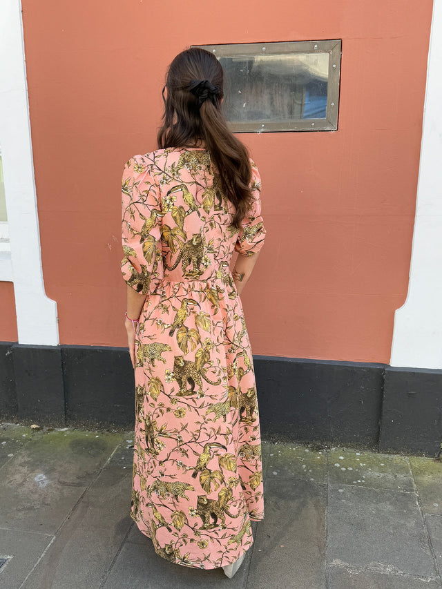 The Well Worn women wearing printed dress back view