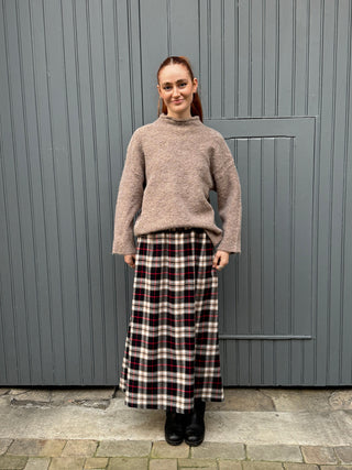 women wearing tartan skirt