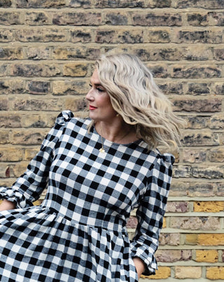 women wearing black and white dress