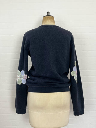 upcycled patchwork sweatshirt on mannequin