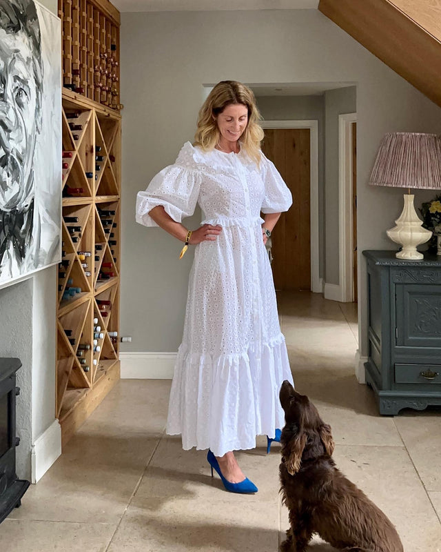 The Well Worn women with dog wearing white dress