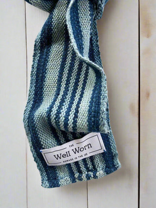 narrow indigo scarf on table label