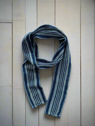 narrow indigo scarf on table