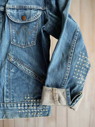 cuff-detail-stitched-denim-jacket-on-table